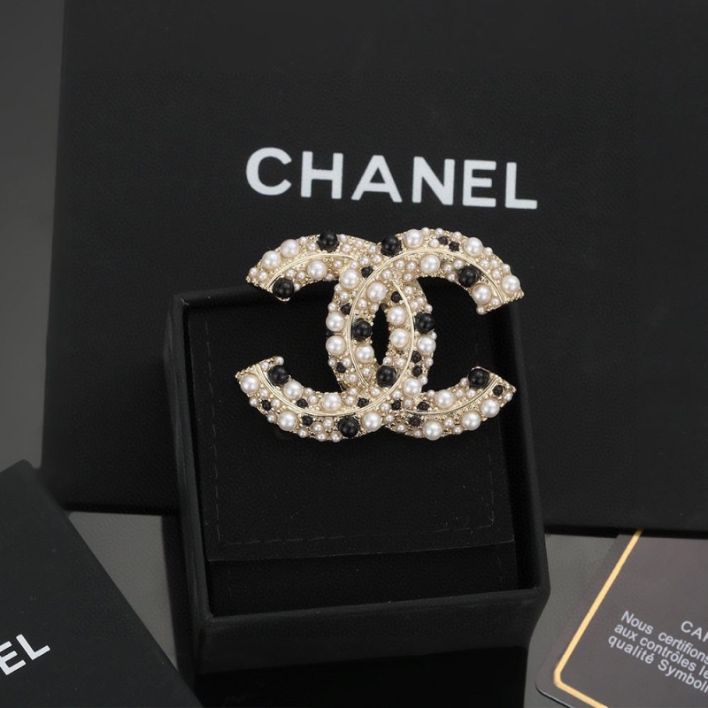 Ch*el brooches